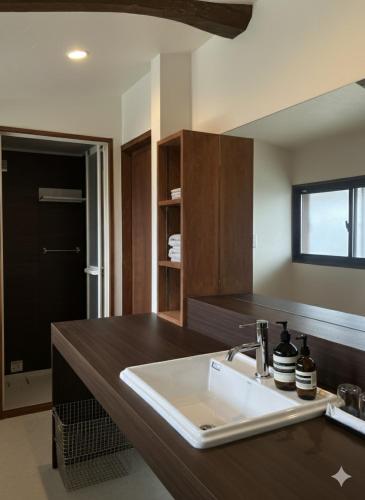 a kitchen with a sink and a wooden counter top at BLANKS - Vacation STAY 37519v in Taisha