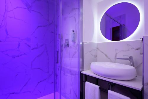 a bathroom with a sink and a mirror at Hotel Patria in Rome