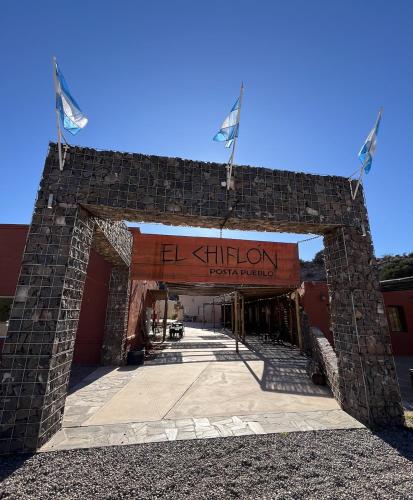 an entrance to a building with a brick wall at El Chiflon Posta Pueblo in El Chiflón