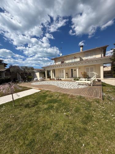 a house with a bench in front of it at Villa Concetta in Torre del Lago Puccini