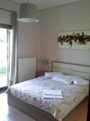 Postel nebo postele na pokoji v ubytování Villa Kallimanis
