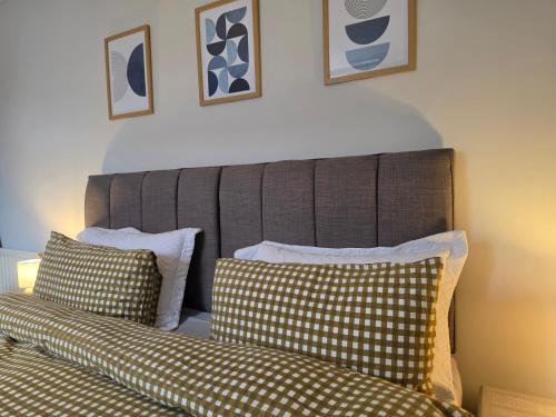 a bedroom with two beds and two pillows at Ample town house in Workington, West Lakes, Lake District in Workington