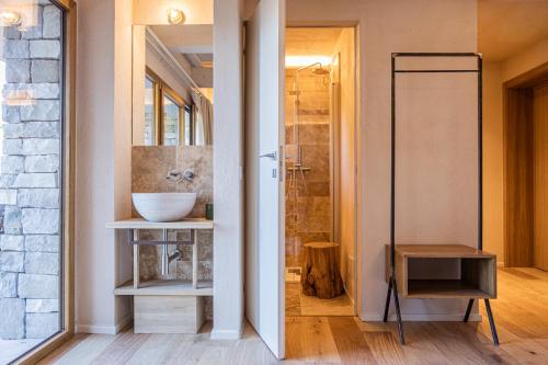 a bathroom with a sink and a shower at Valle Benedetta Retreat Center in Livorno