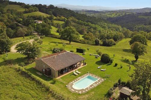 an aerial view of a house with a swimming pool at Villa Borgiano - Happy Rentals in Scansano