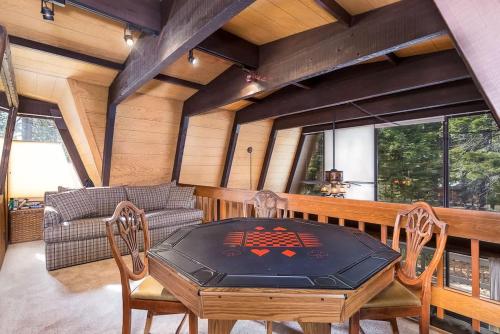 a dining room with a table and chairs at Runnymeade Cottage in Kings Beach