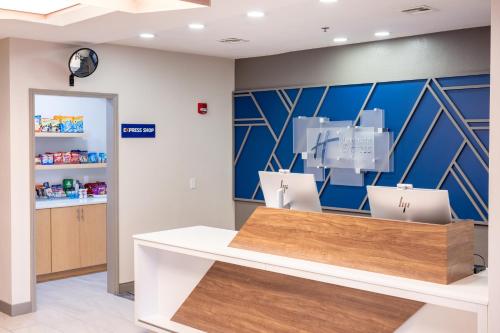 a pharmacyacist with a counter in a store at Holiday Inn Express Hotel & Suites Wichita Airport by IHG in Wichita