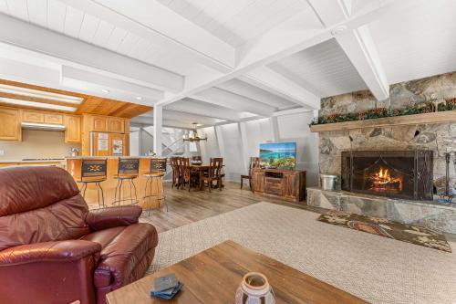 a living room with a couch and a fireplace at Agate Bay Chalet in Carnelian Bay