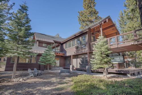 a large wooden house in the woods at Stone Peak Lodge in Tahoe City