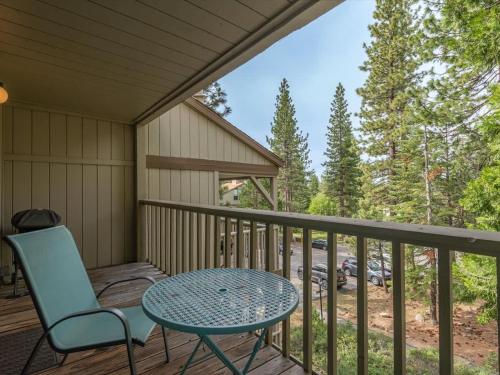 a patio with a table and chairs on a deck at Rooted Resort in Kings Beach