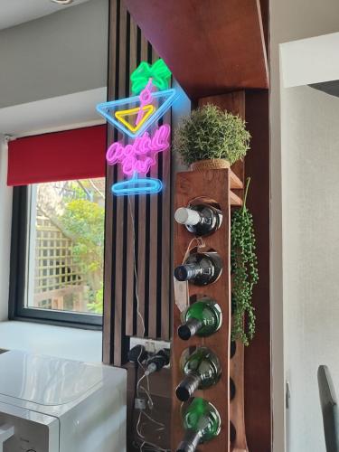 a room with a bunch of wine bottles at the ring of kerry riverside apartment in Killorglin