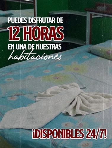 a poster for a hospital with a towel on the floor at New Auto Motel in Barcelona