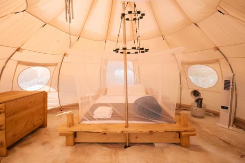 a bedroom in a tent with a bed in it at Paradise Ranch Inn - Mindful Tent in Three Rivers
