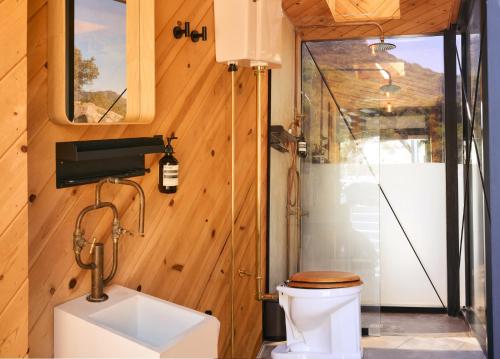 a bathroom with a toilet and a shower at Paradise Ranch Inn - Mindful Tent in Three Rivers
