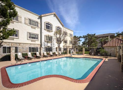 a large swimming pool in front of a building at Ayres Suites Ontario at the Mills Mall - Rancho Cucamonga in Ontario