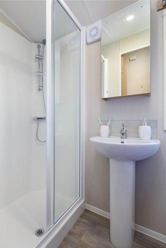 a bathroom with a sink and a shower at Solway Holiday Park in Silloth