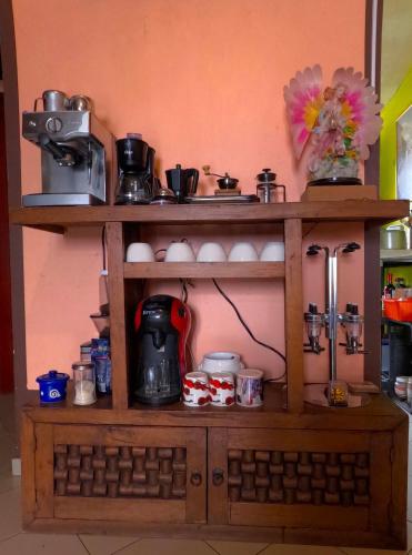 a wooden shelf with a coffee maker on it at Cómoda habitación para descanso, La casa del artista in Toluca