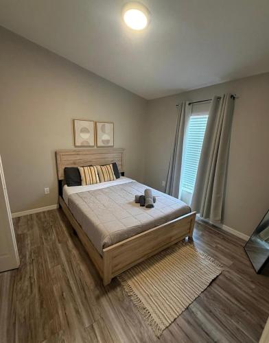 a bedroom with a bed and a window at Welcome to LUX Guesthouse! in Ruskin