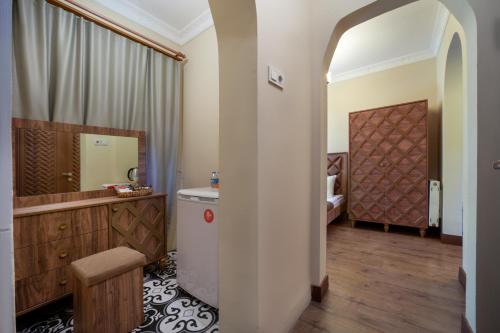 a bathroom with a tub and a sink and a mirror at Taxim in Istanbul