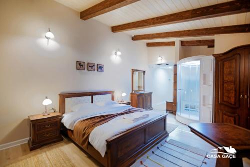 a bedroom with a large bed in a room at Casa Gaçe Hotel in Korçë