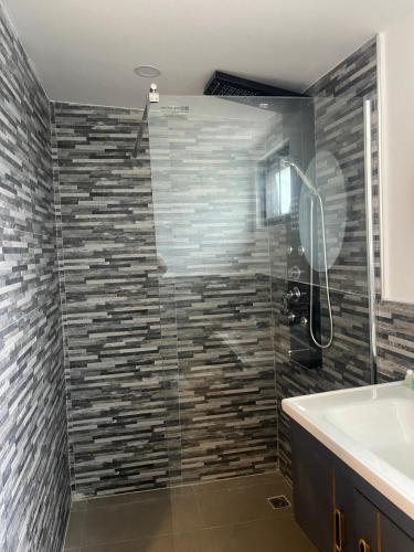 a bathroom with a shower and a sink at Villa Sabaï • Private Pool • Thong Krut in Nathon Bay
