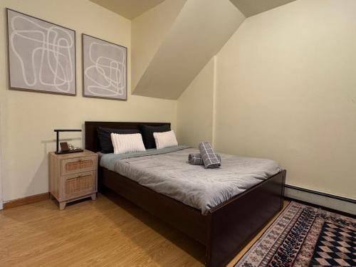 a bedroom with a large bed and a rug at Sunny Apt by the park Mins away from midtown New York in Jersey City