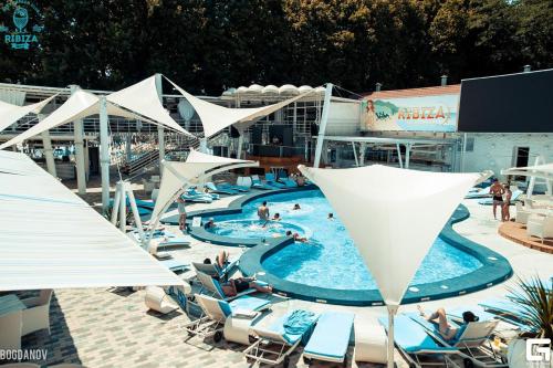 a pool on a cruise ship with people in it at Hotel Prichal in Simferopol