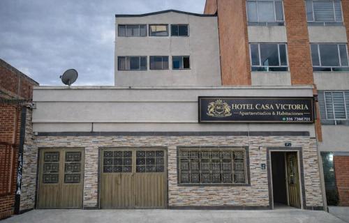 a building with a hotel cash verbal sign on it at CASA HOTEL VICTORIA Av 30 in Bogotá