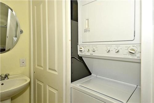 a white washer and dryer in a bathroom at Gem-By-The-Sea in Cape May Point