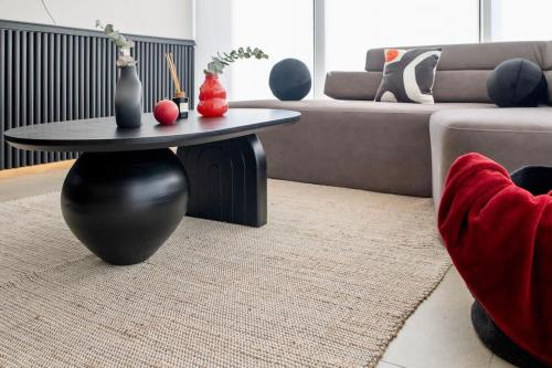 a living room with a coffee table and a couch at SANTA FE Red Beautiful Apartment! in Mexico City