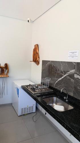 Large barbecue area with a swimming pool and a spacious room