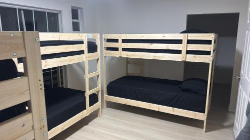 a couple of bunk beds in a room at KTown Sanctuary Soul in Los Angeles