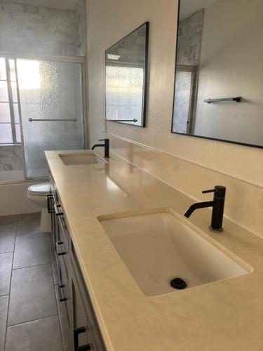 a bathroom with a sink and a toilet at KTown Sanctuary Soul in Los Angeles