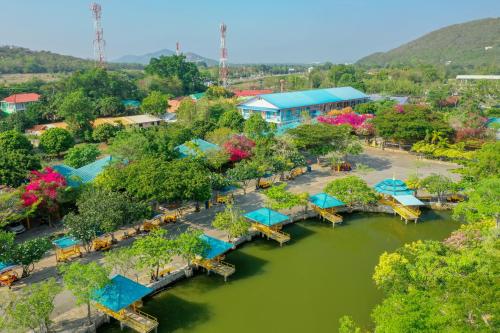 an aerial view of a resort with a river at แฝดสามการ์เด้นท์รีสอร์ท แสมสาร Fadsarm Garden Resort Samaesan in Sattahip