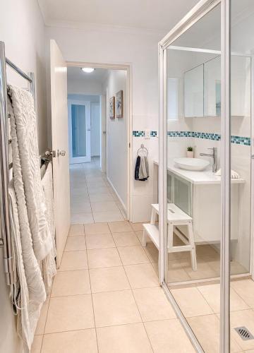 a bathroom with a shower and a sink at St Helens in Edithburgh