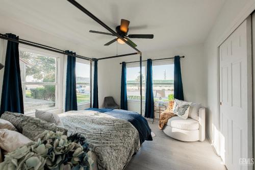 a bedroom with a bed and a ceiling fan at Luxury Stay Near Downtown Bakersfield in Bakersfield