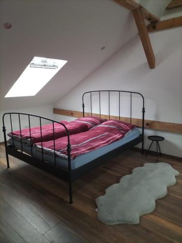 a bedroom with a bed in a attic at Bullerbü in Fincken