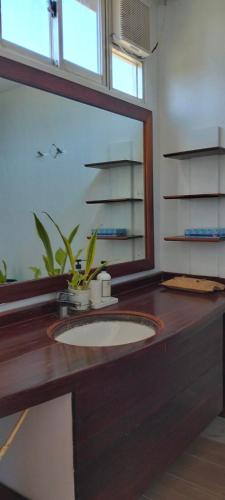 a bathroom counter with a sink and a mirror at Cote Resort in Dipaculao