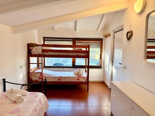 two bunk beds in a room with a window at Casa Barbara in Sant Arcangelo