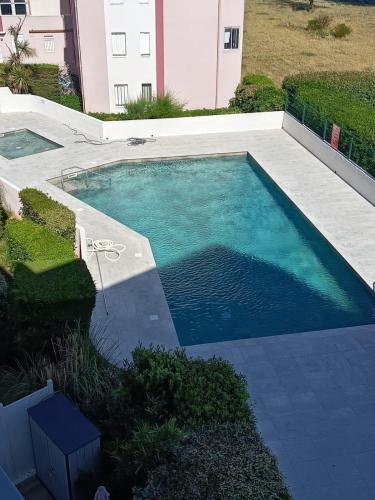 T2 - Les pieds dans le sables en toutes saisons 5 couchages - climatisation - parking privée - piscine - situation optimum et rare - Amoureva - Plage Richelieu- Cap d'Agde