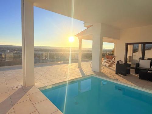 a house with a swimming pool and a patio at Vila Pombal Tomar - Luxury Apartment with private pool and Castle View in Tomar