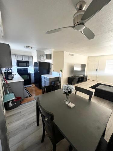 a living room with a dining room table and a kitchen at Downtown Phoenix Condo in Phoenix