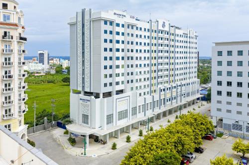 an overhead view of a large white building at Belmont Hotel Iloilo in Iloilo City