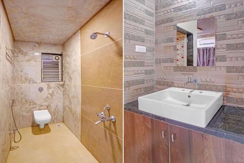 a bathroom with a sink and a toilet at FabHotel Aaryras Heritage Resort in Mahabaleshwar