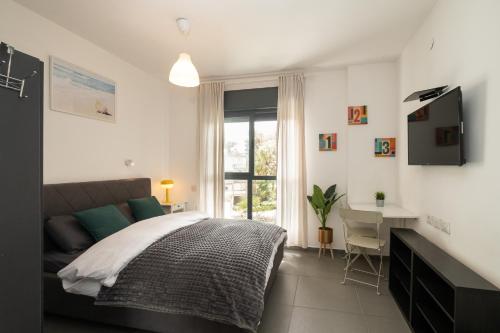 Llit o llits en una habitació de Assuta studio