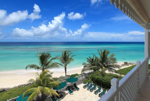 a view of the beach from the balcony of a resort at Coral Sands Beach Resort in Bridgetown