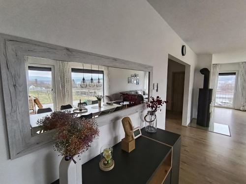 a kitchen with a counter and a large window at Lipnohaus in Horní Planá