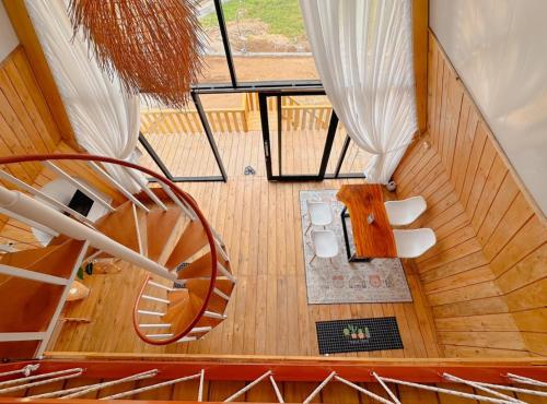 an overhead view of a spiral staircase in a house at Griya Cabin 5 Dieng in Diyeng