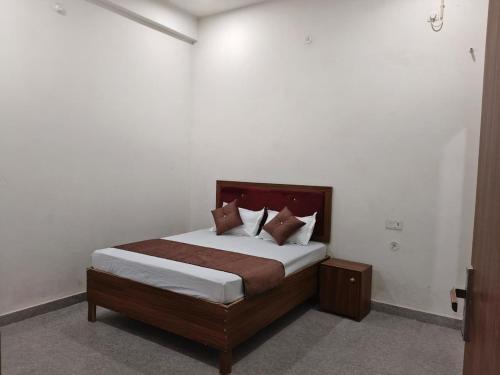 a bedroom with a bed in a white room at Sivago hotel in Kosi