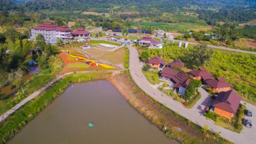 an aerial view of a resort with a lake at Phurua Sanctuary Resort and Spa in Phu Rua