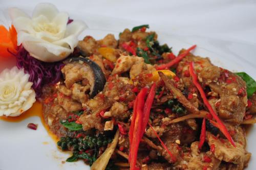 a white plate of food with shrimp and vegetables at Phurua Sanctuary Resort and Spa in Phu Rua